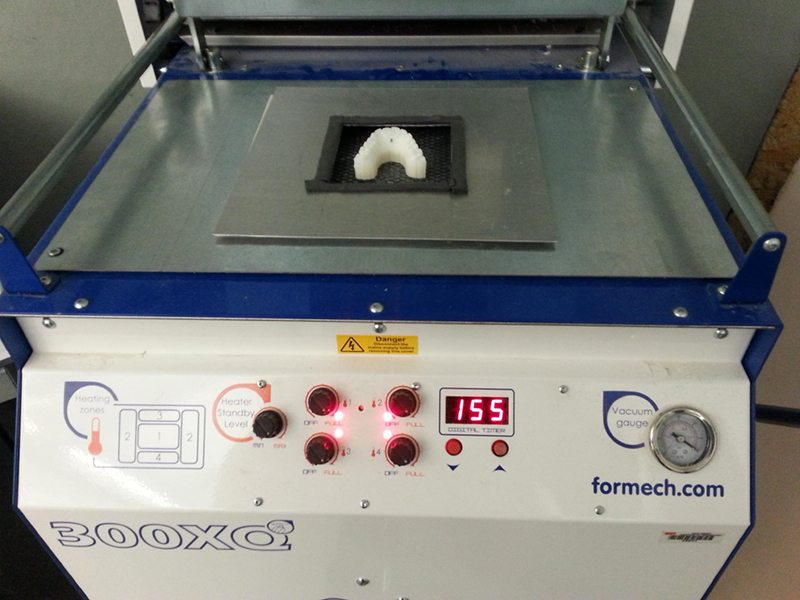Fabrication sous vide des gouttières